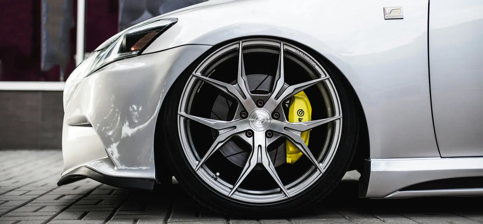 Custom alloy wheel on a silver sports car