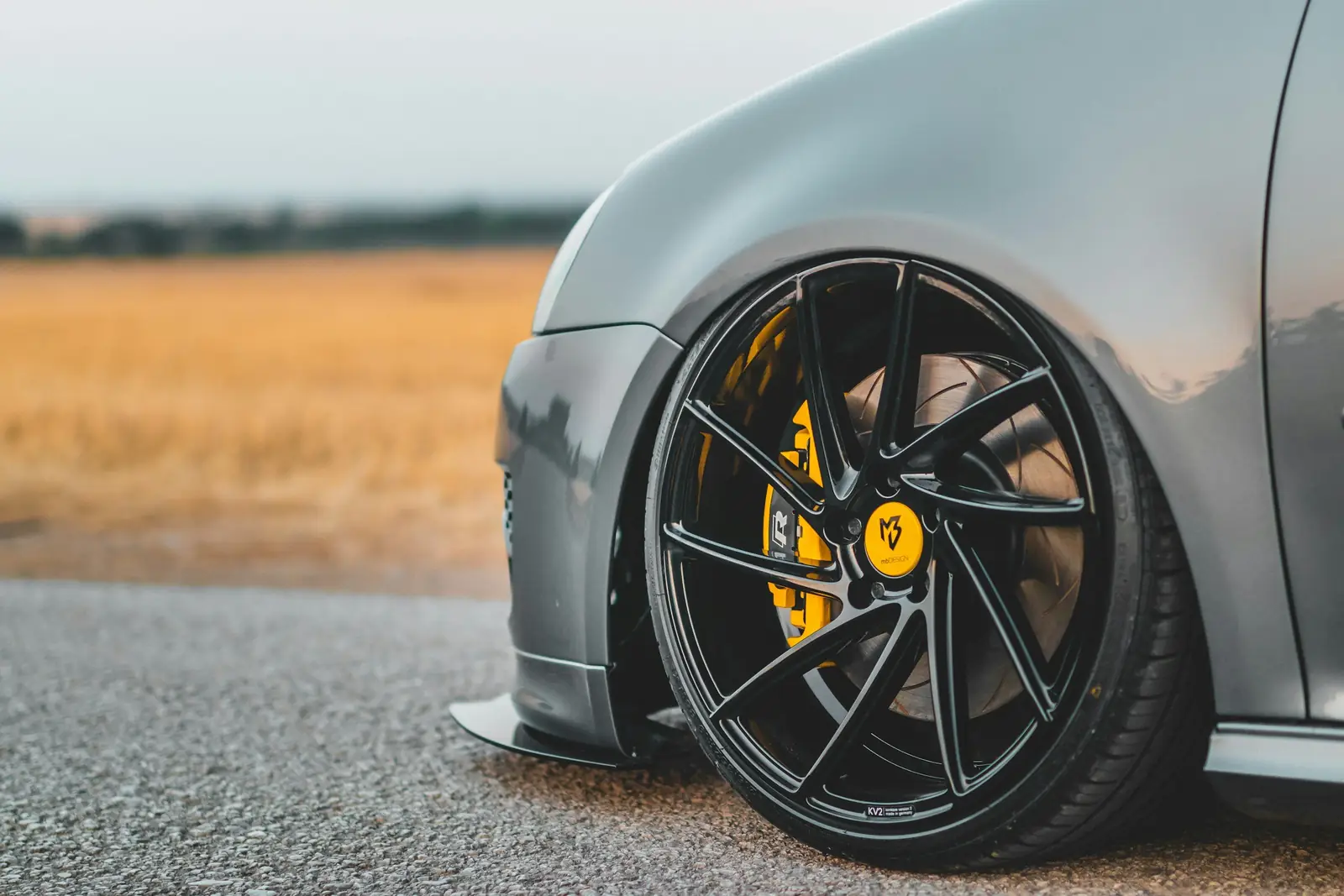 Black alloy rim with yellow brake caliper